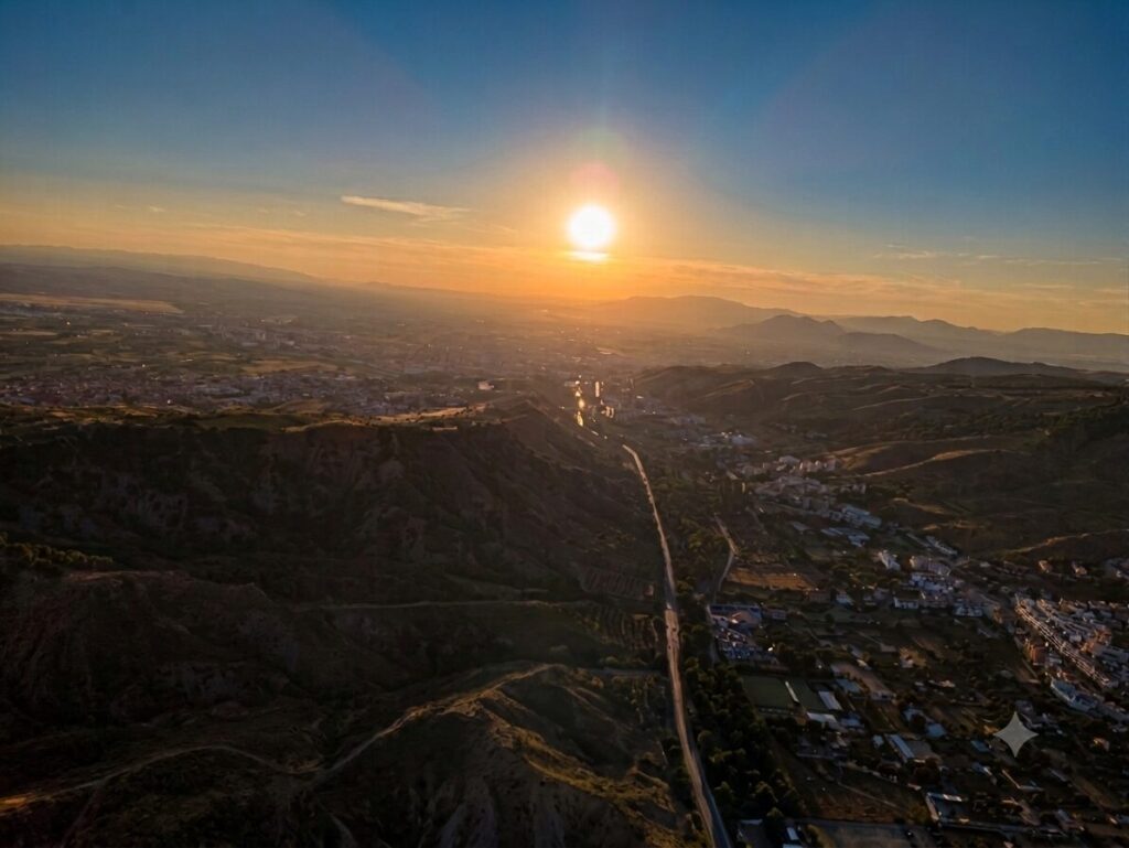Things to Do in Granada 3 Sunset over the Granada valley seen from a paraglider